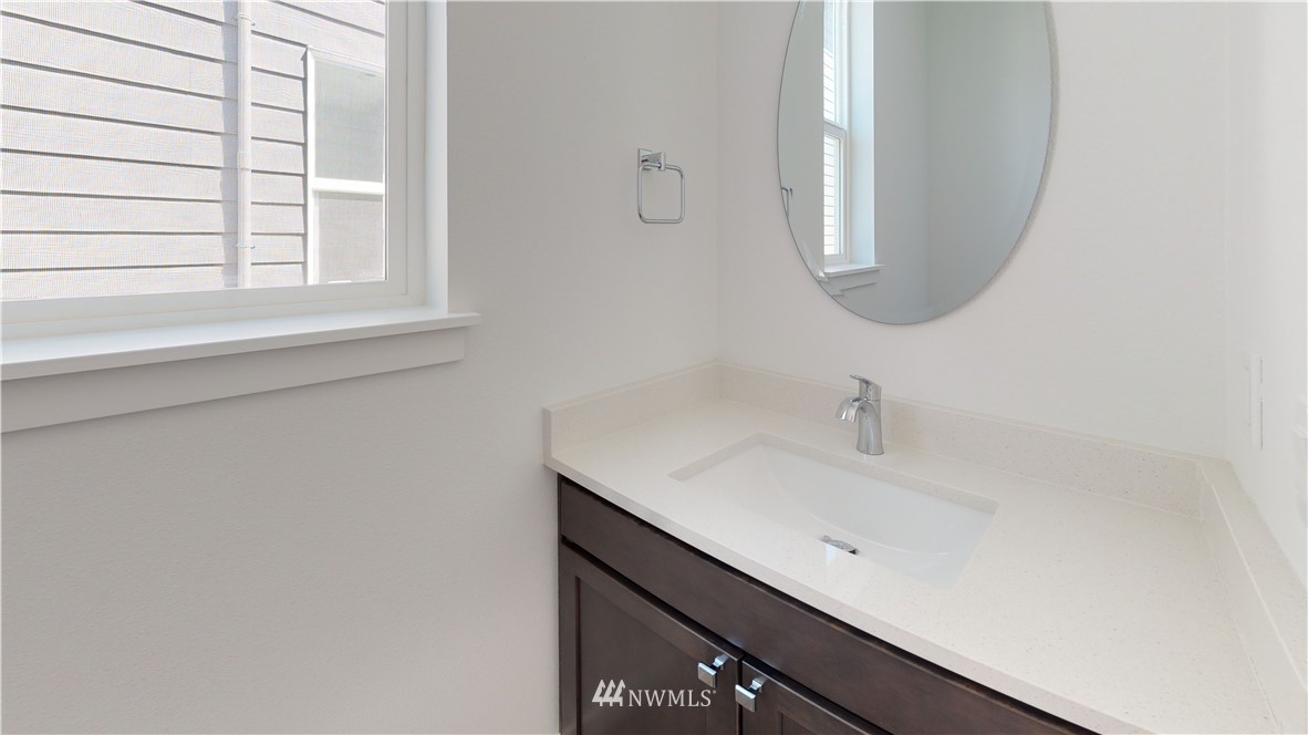 320 South 48th Street, Unit H19 Renton, WA 98055 - Photo 25 of 29 a bathroom with a sink and a mirror