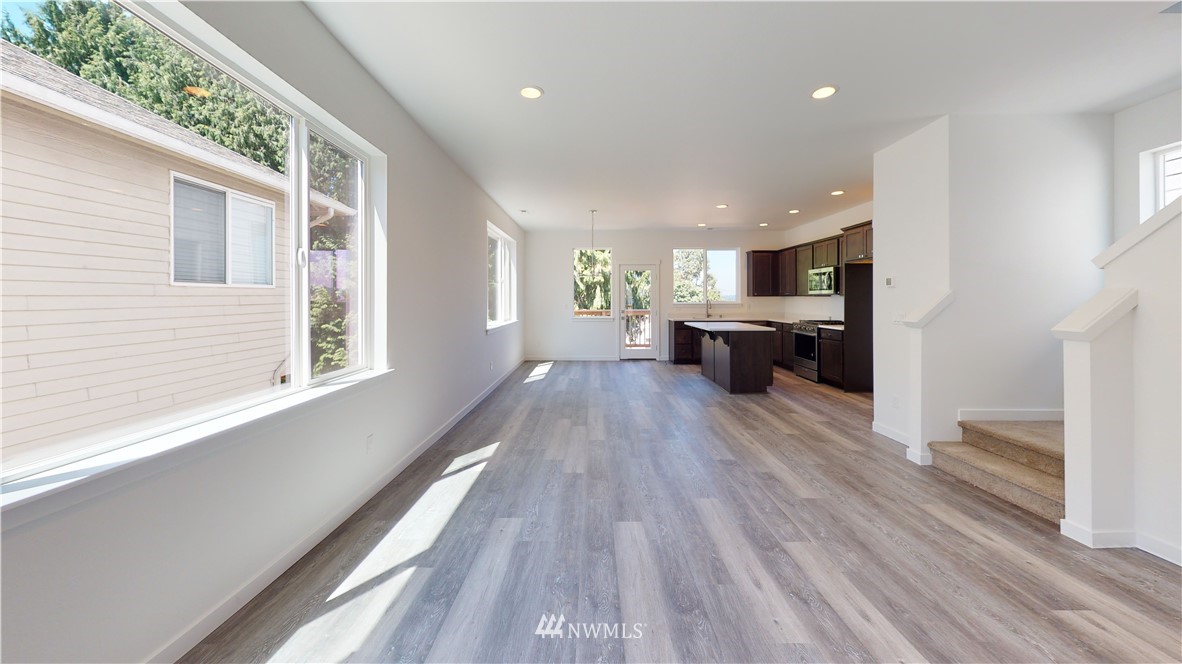 320 South 48th Street, Unit H19 Renton, WA 98055 - Photo 27 of 29 a view of a living room with furniture and wooden floor