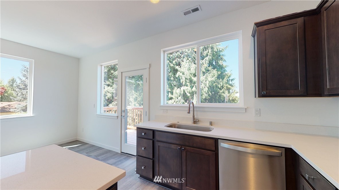 320 South 48th Street, Unit H19 Renton, WA 98055 - Photo 7 of 29 a kitchen with a sink and a window