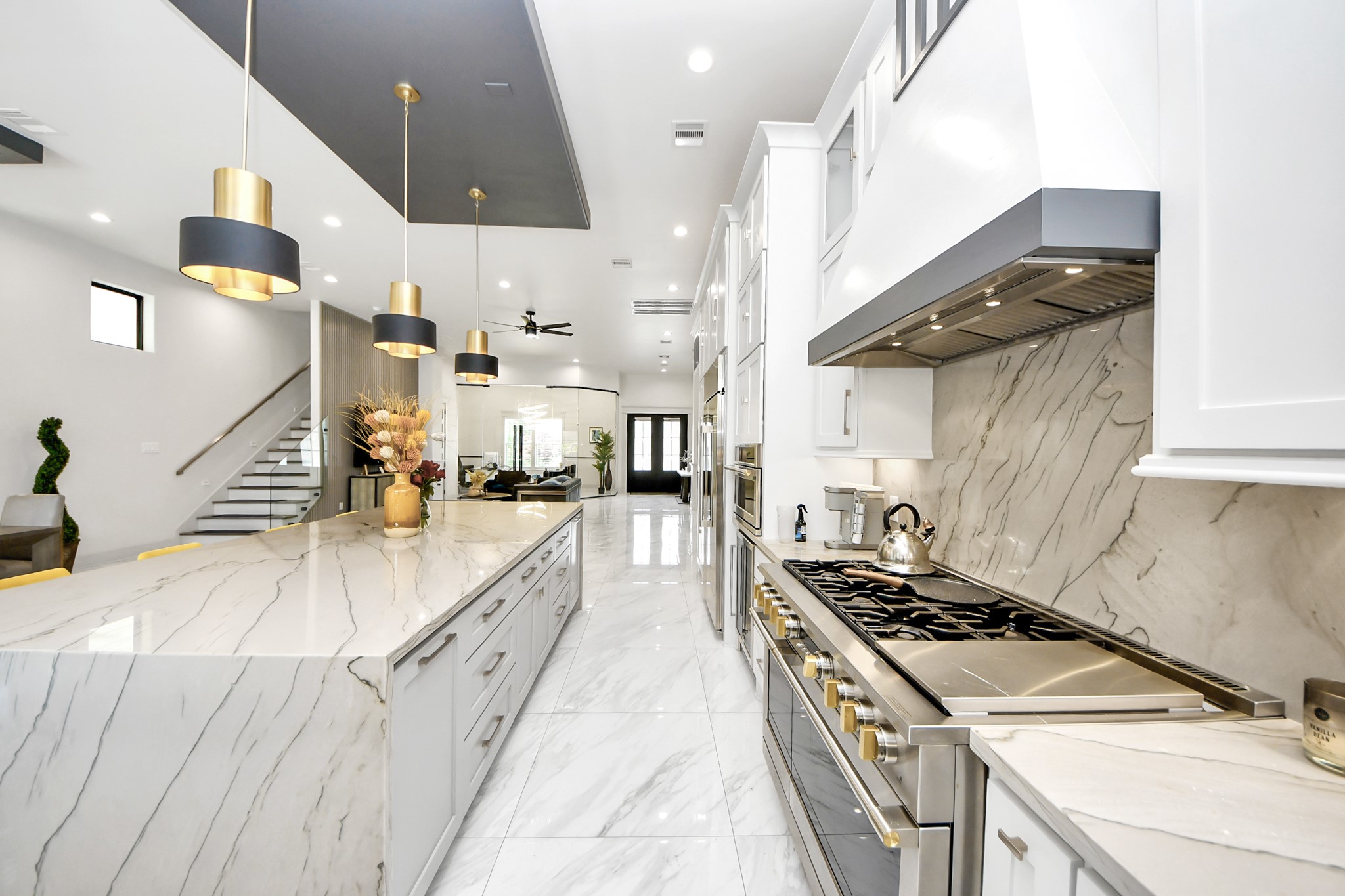 3520 Beauchamp Street Houston, TX 77009 - Photo 22 of 50 a kitchen with stainless steel appliances granite countertop a sink a stove and a wooden floors