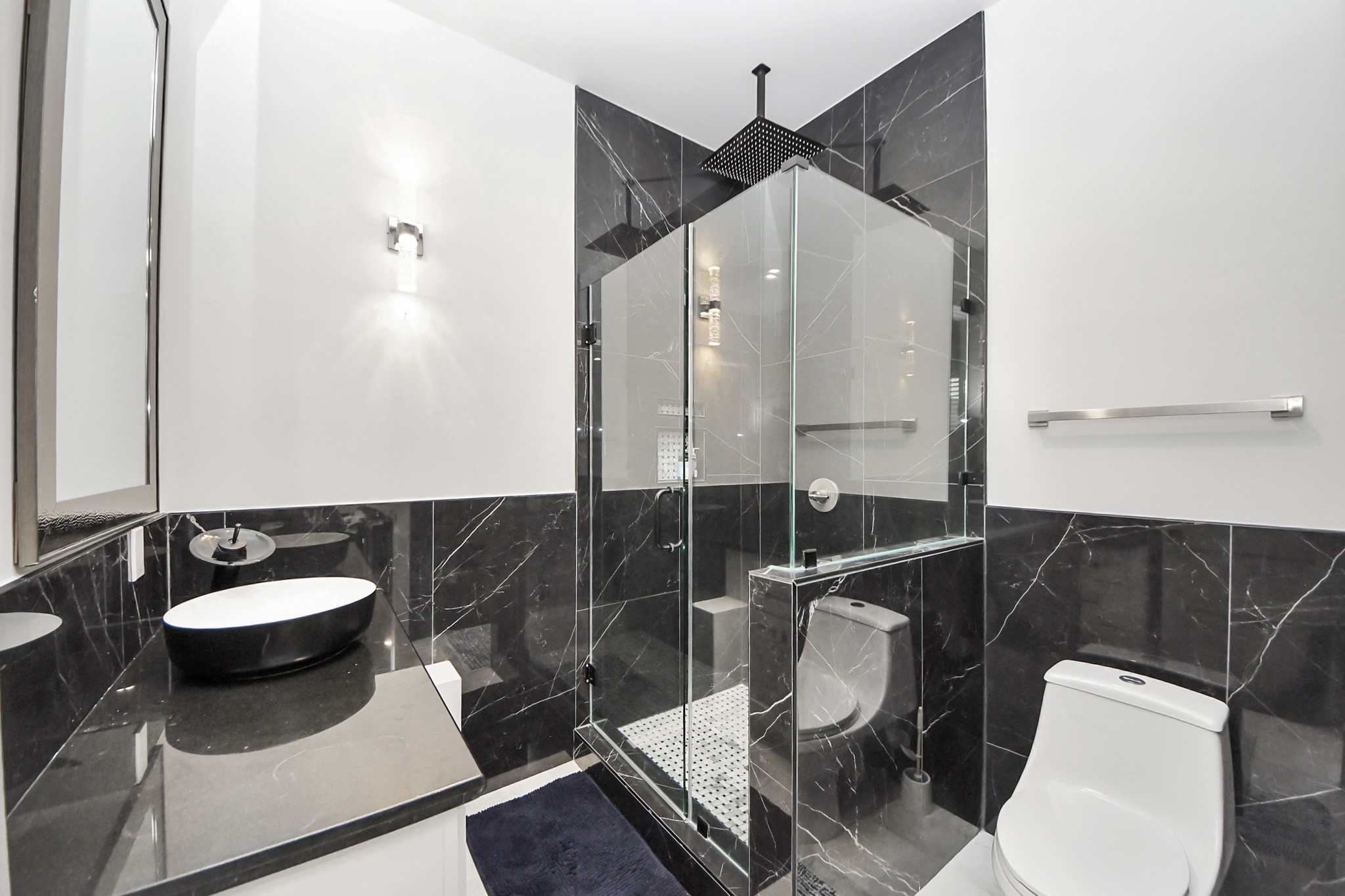 3520 Beauchamp Street Houston, TX 77009 - Photo 31 of 50 a bathroom with a sink a toilet and a mirror