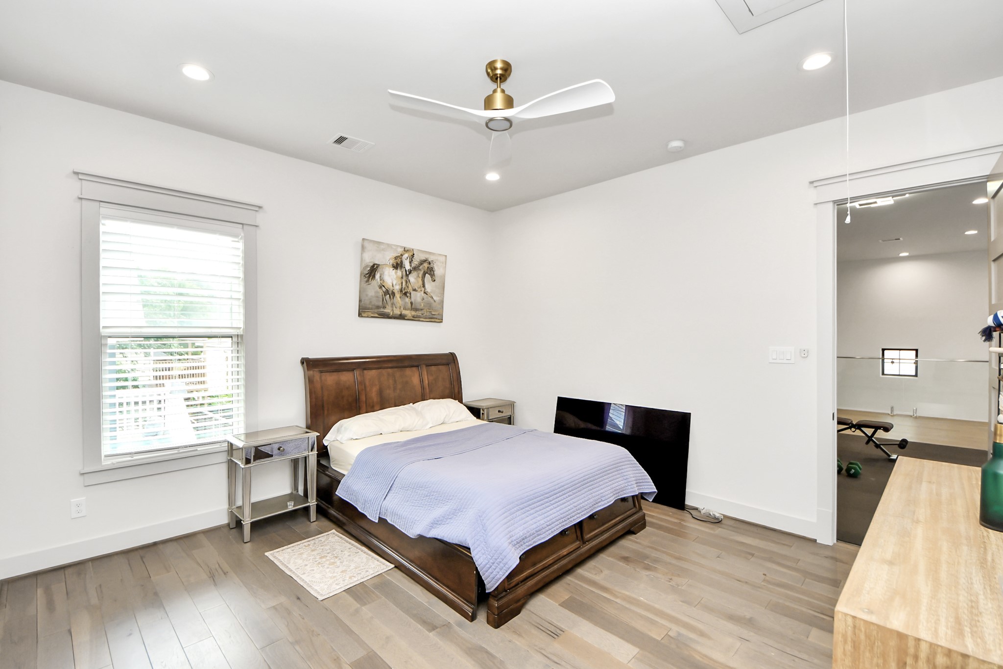 3520 Beauchamp Street Houston, TX 77009 - Photo 32 of 50 a bedroom with a bed and wooden floor