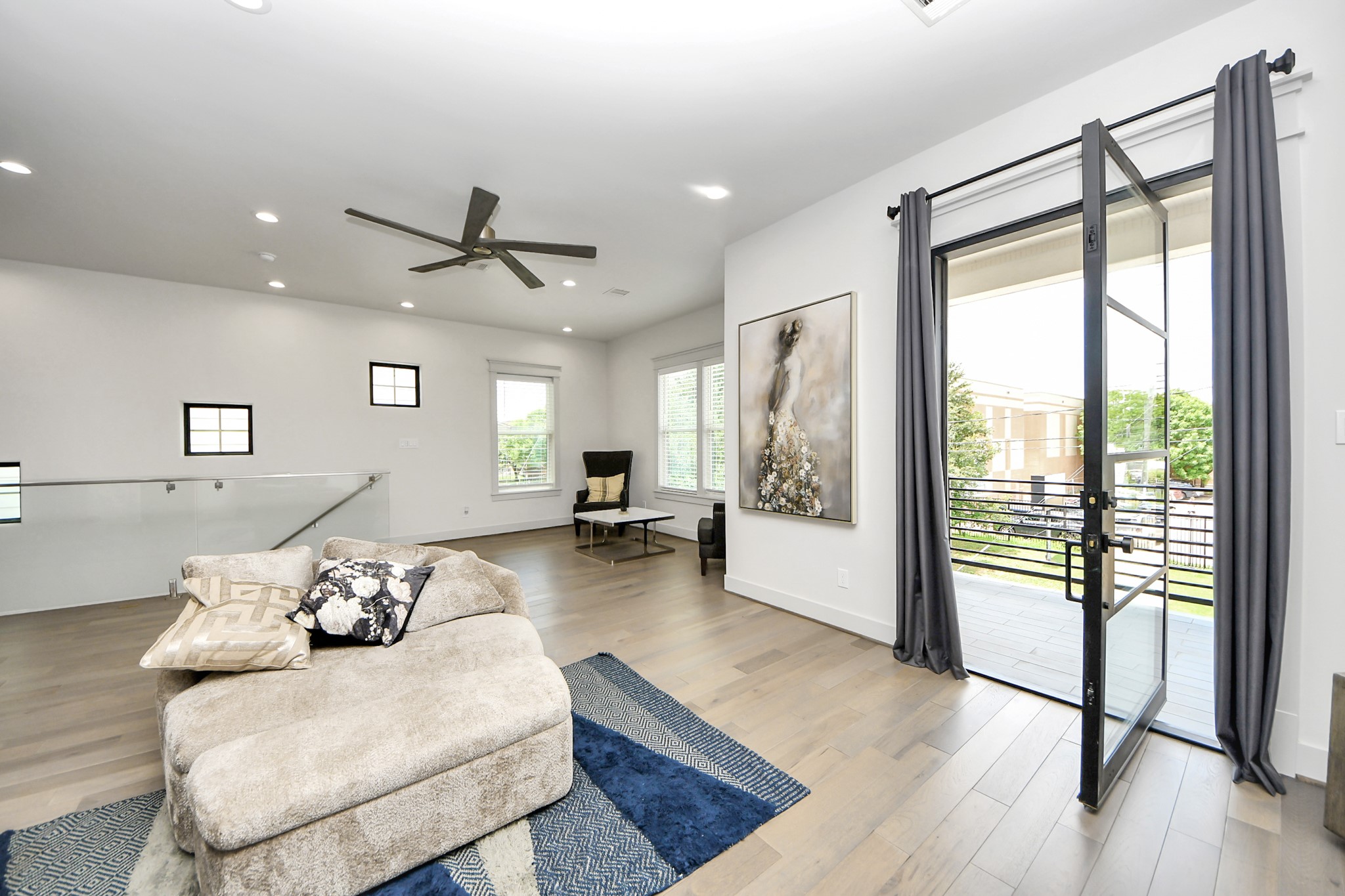 3520 Beauchamp Street Houston, TX 77009 - Photo 44 of 50 a living room with furniture and a large window with wooden floor