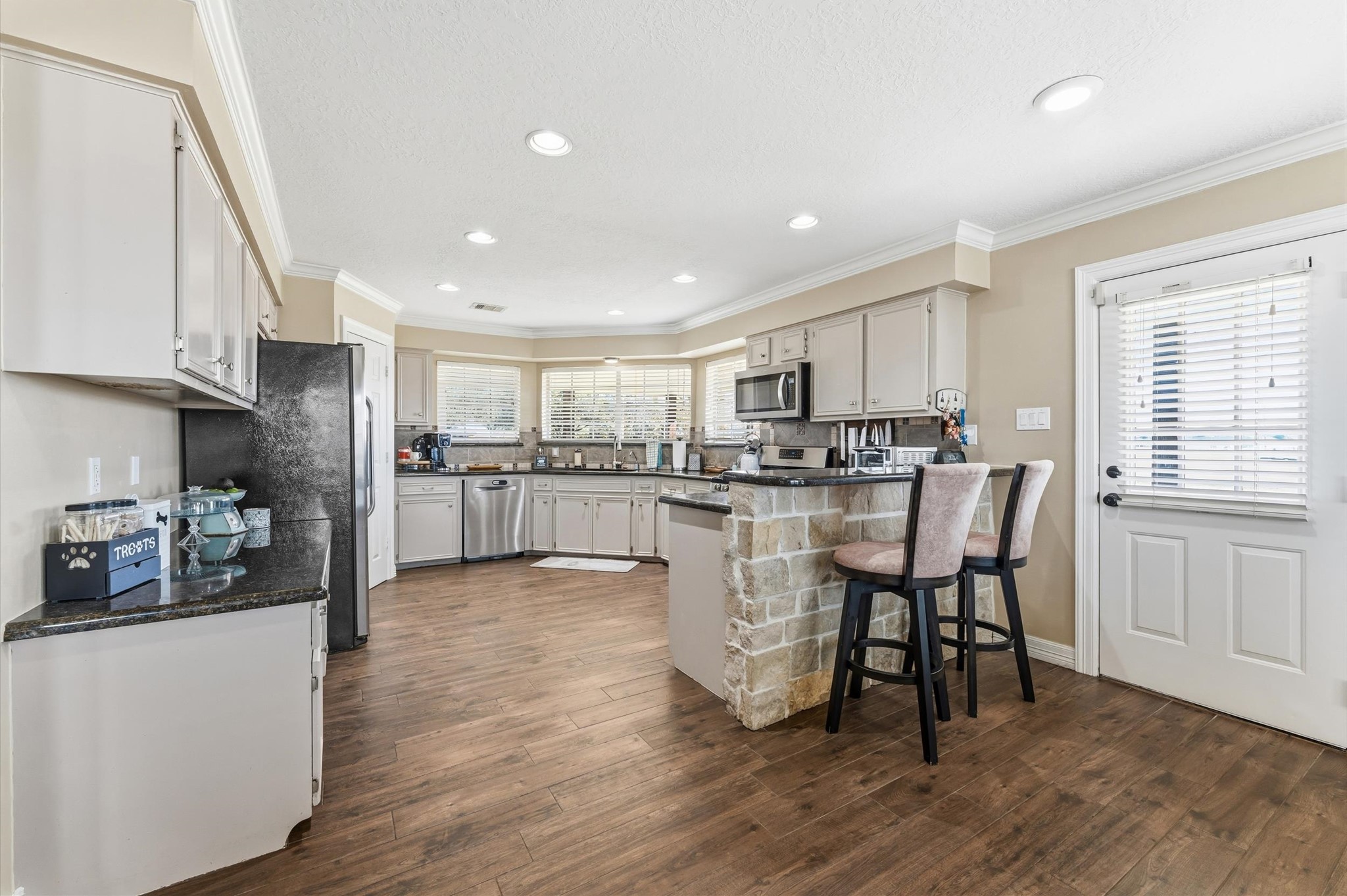 1840 Caroline Street Dickinson, TX 77539 - Photo 13 of 45 Kitchen offers a granite Topped Breakfast Bar + Built in Desk