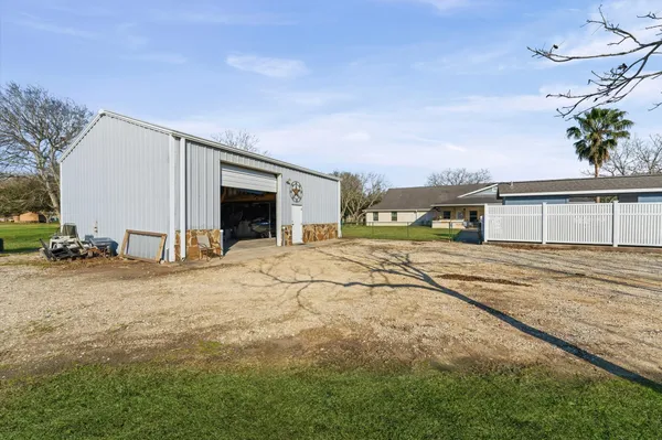 a view of a room with lots of gym equipment