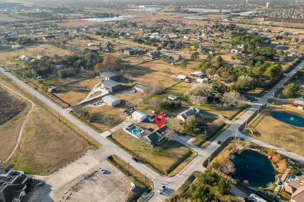 an aerial view of residential houses with outdoor space