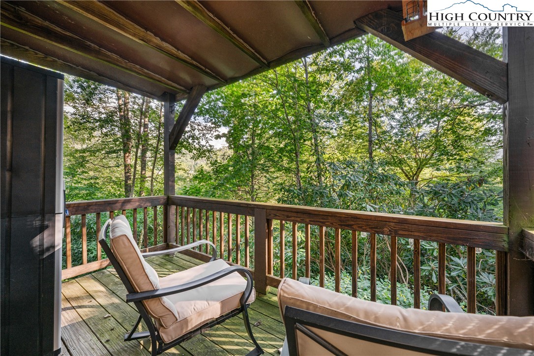 102 Hemlock Hill Road, Unit C Banner Elk, NC 28604 - Photo 13 of 22 a view of a two chair in the balcony