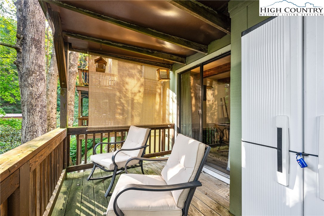 102 Hemlock Hill Road, Unit C Banner Elk, NC 28604 - Photo 14 of 22 a view of balcony with furniture