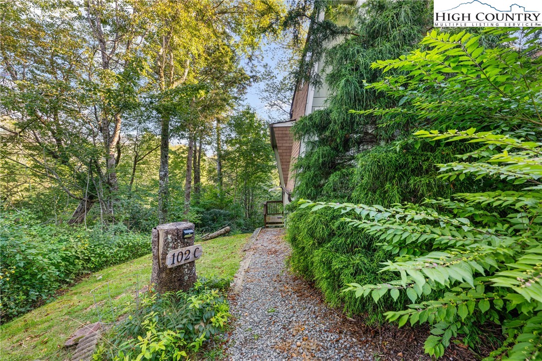 102 Hemlock Hill Road, Unit C Banner Elk, NC 28604 - Photo 15 of 22 a wooden fence with some trees