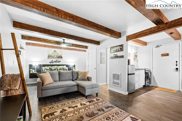 a living room with furniture and a rug