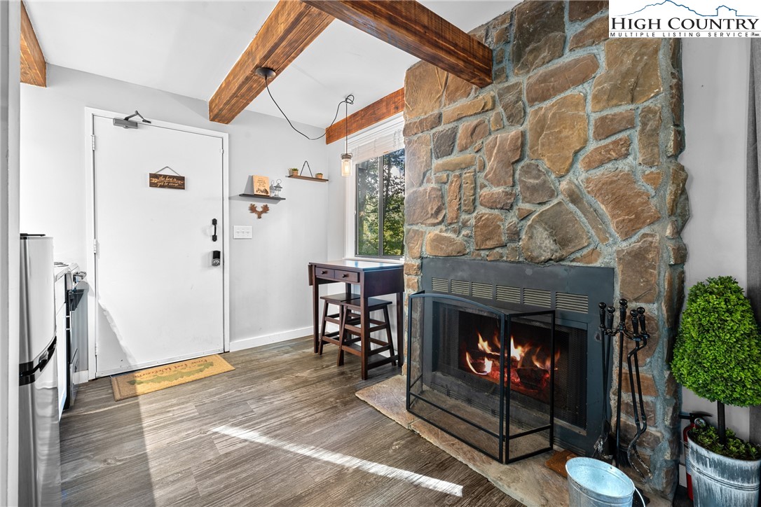 102 Hemlock Hill Road, Unit C Banner Elk, NC 28604 - Photo 4 of 22 a living room with furniture and a fireplace