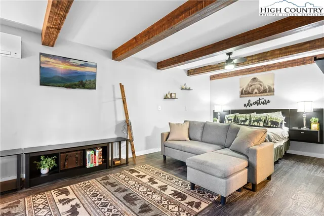 a living room with furniture and a rug