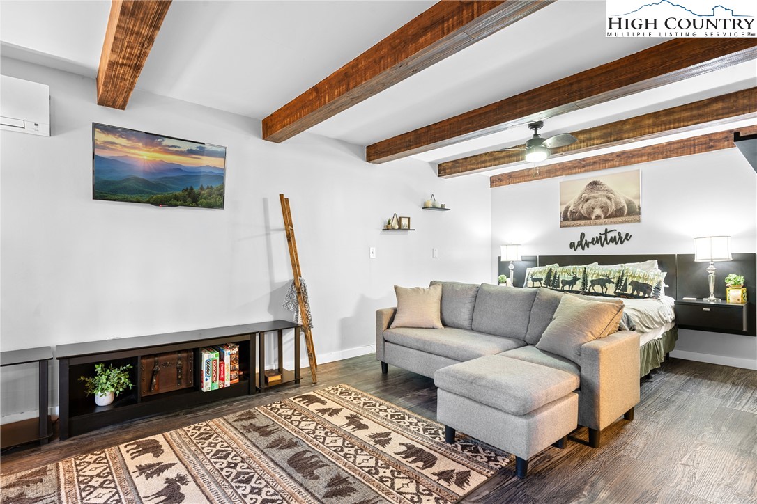 102 Hemlock Hill Road, Unit C Banner Elk, NC 28604 - Photo 5 of 22 a living room with furniture and a rug