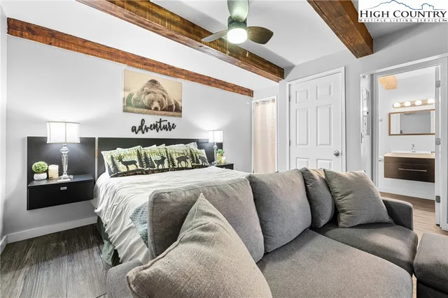 a bedroom with a large bed and a couch