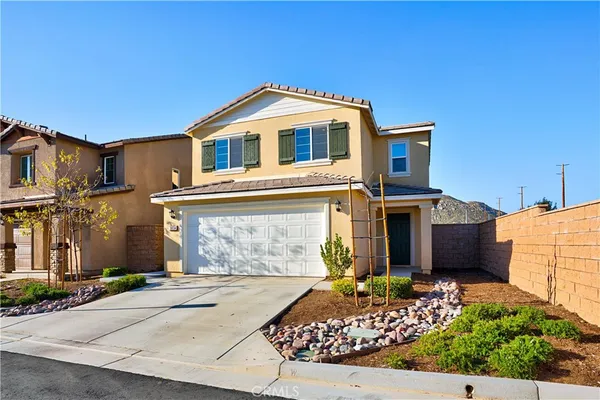 a front view of a house with a garage