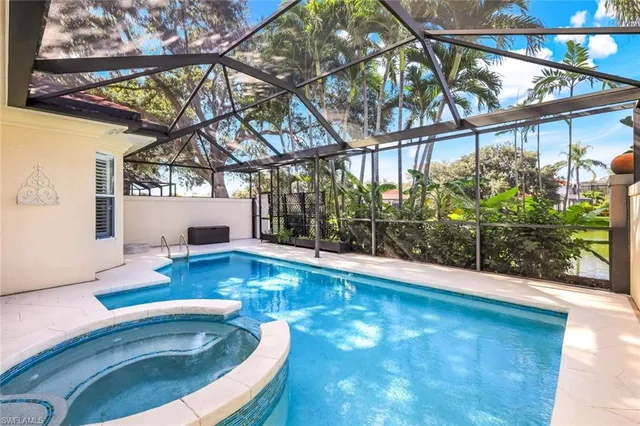 a view of swimming pool with seating space
