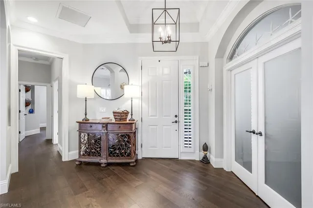 a view of a room with wooden floor and white walls