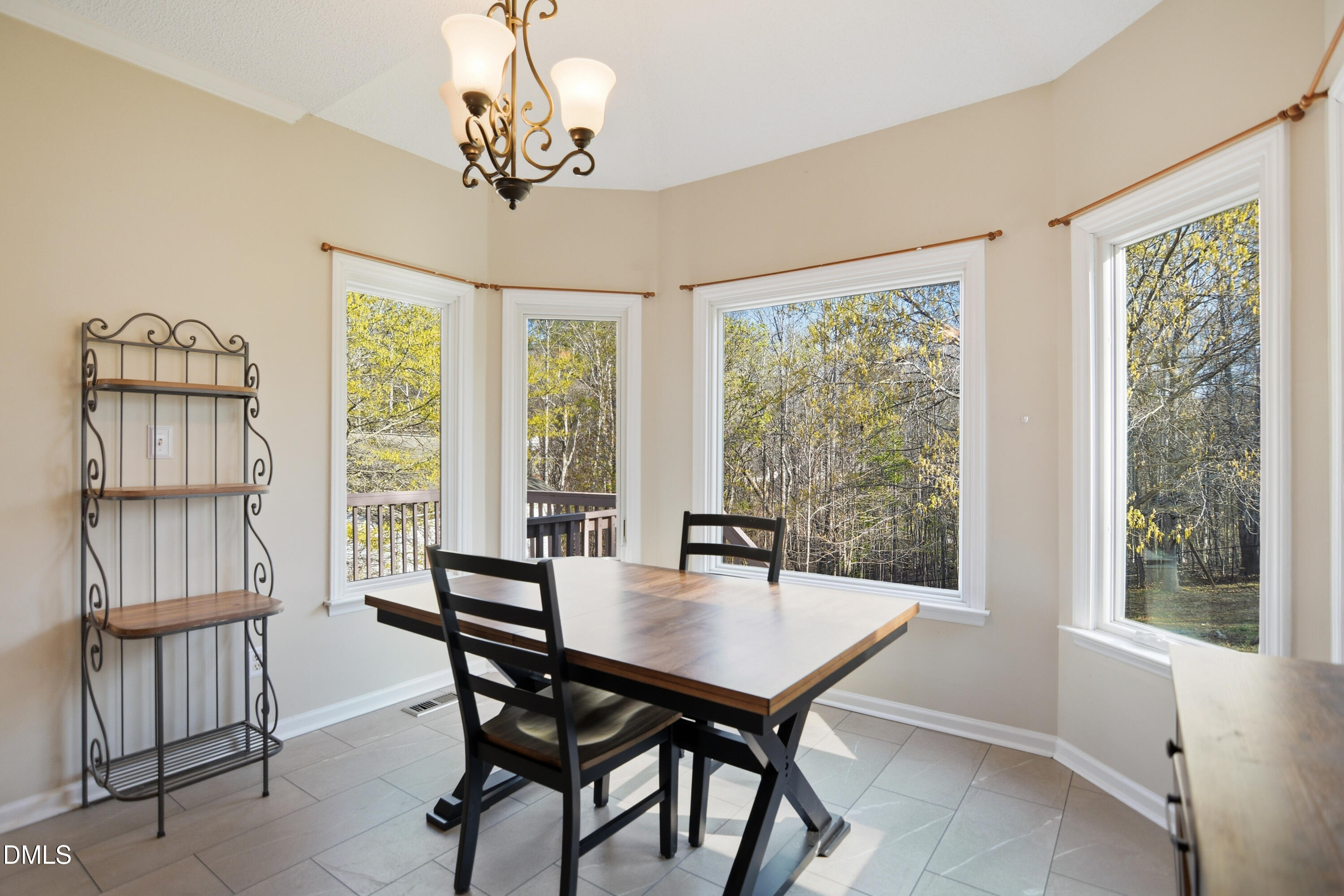 4801 Topstone Road Raleigh, NC 27603 - Photo 11 of 29 a view of a dining room with furniture window and outside view