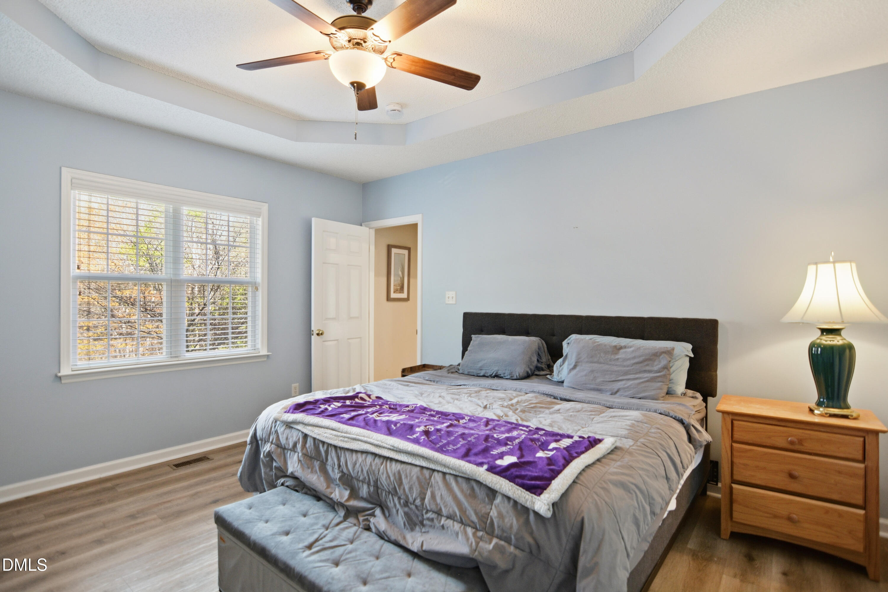 4801 Topstone Road Raleigh, NC 27603 - Photo 12 of 29 a bedroom with a large bed and a window