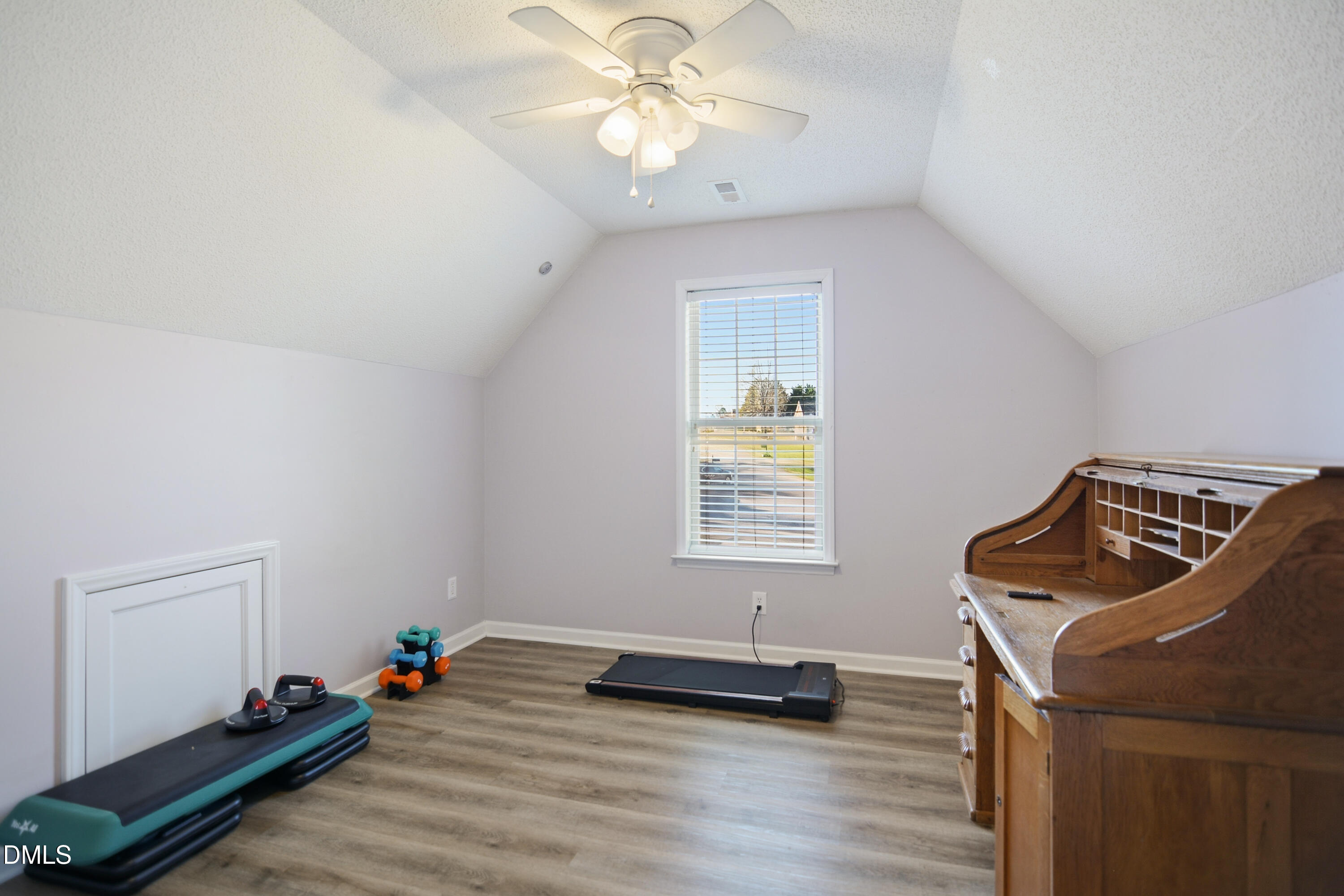 4801 Topstone Road Raleigh, NC 27603 - Photo 19 of 29 a view of workspace with wooden floor and window
