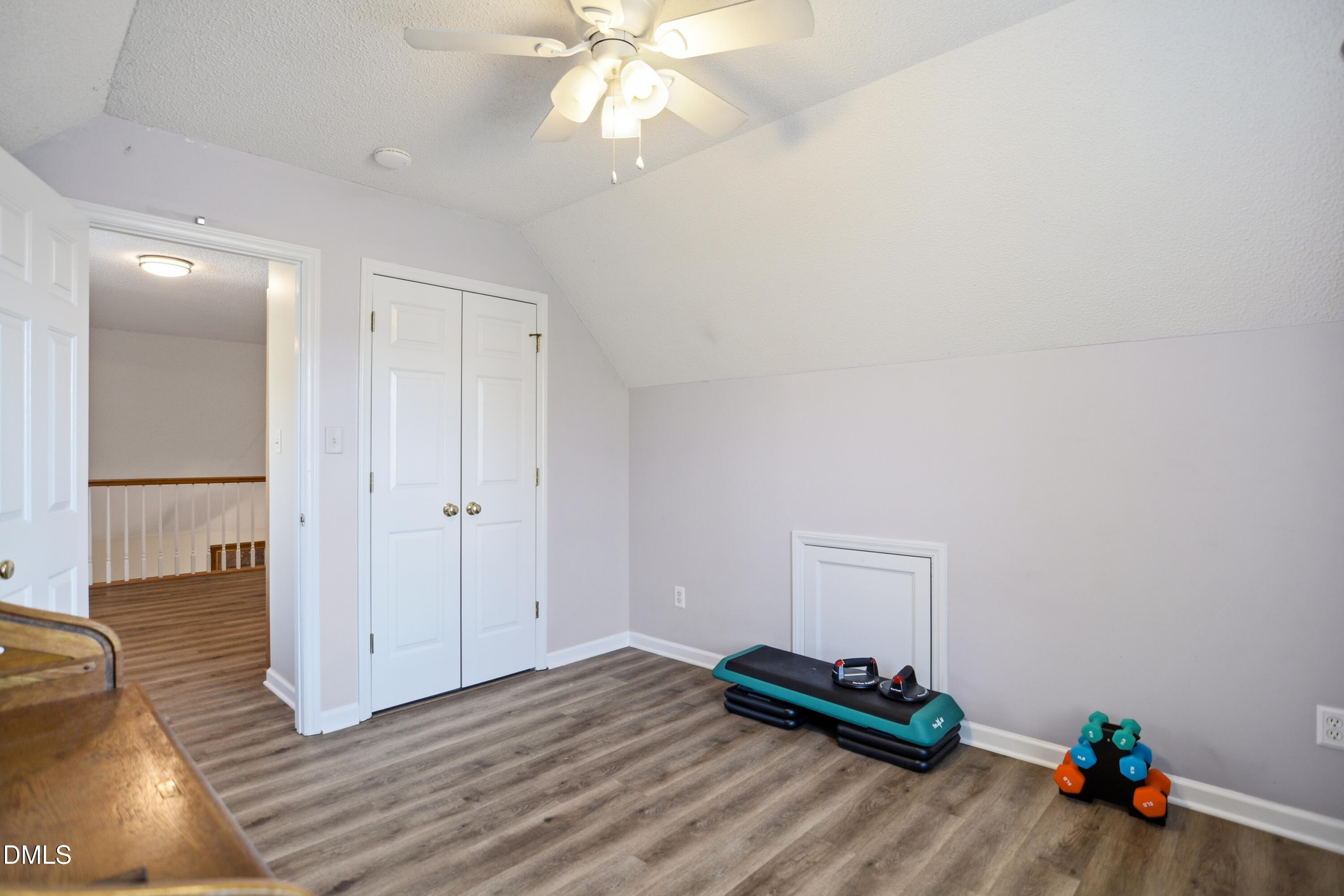 4801 Topstone Road Raleigh, NC 27603 - Photo 20 of 29 a view of a room with wooden floor and ceiling fan