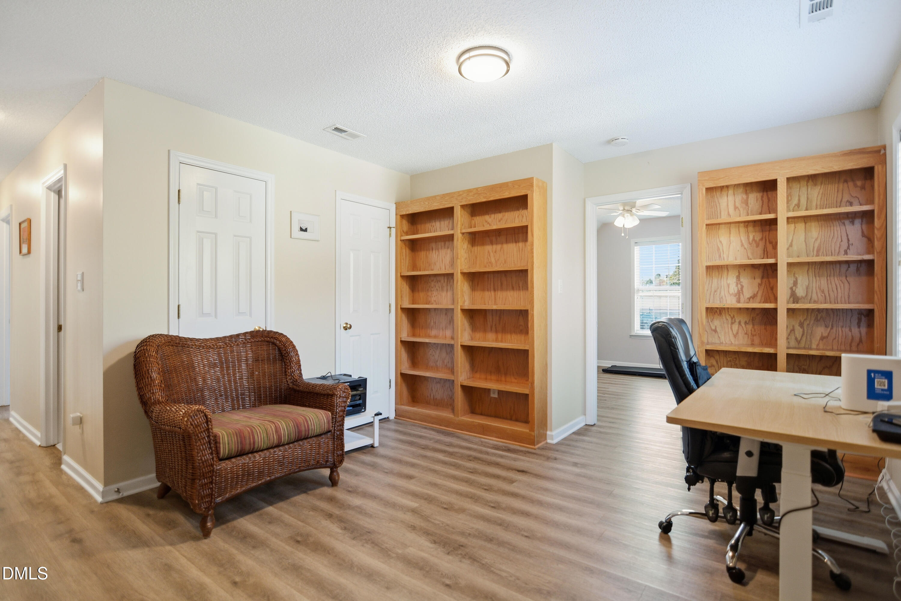4801 Topstone Road Raleigh, NC 27603 - Photo 22 of 29 a living room with furniture and a book shelf