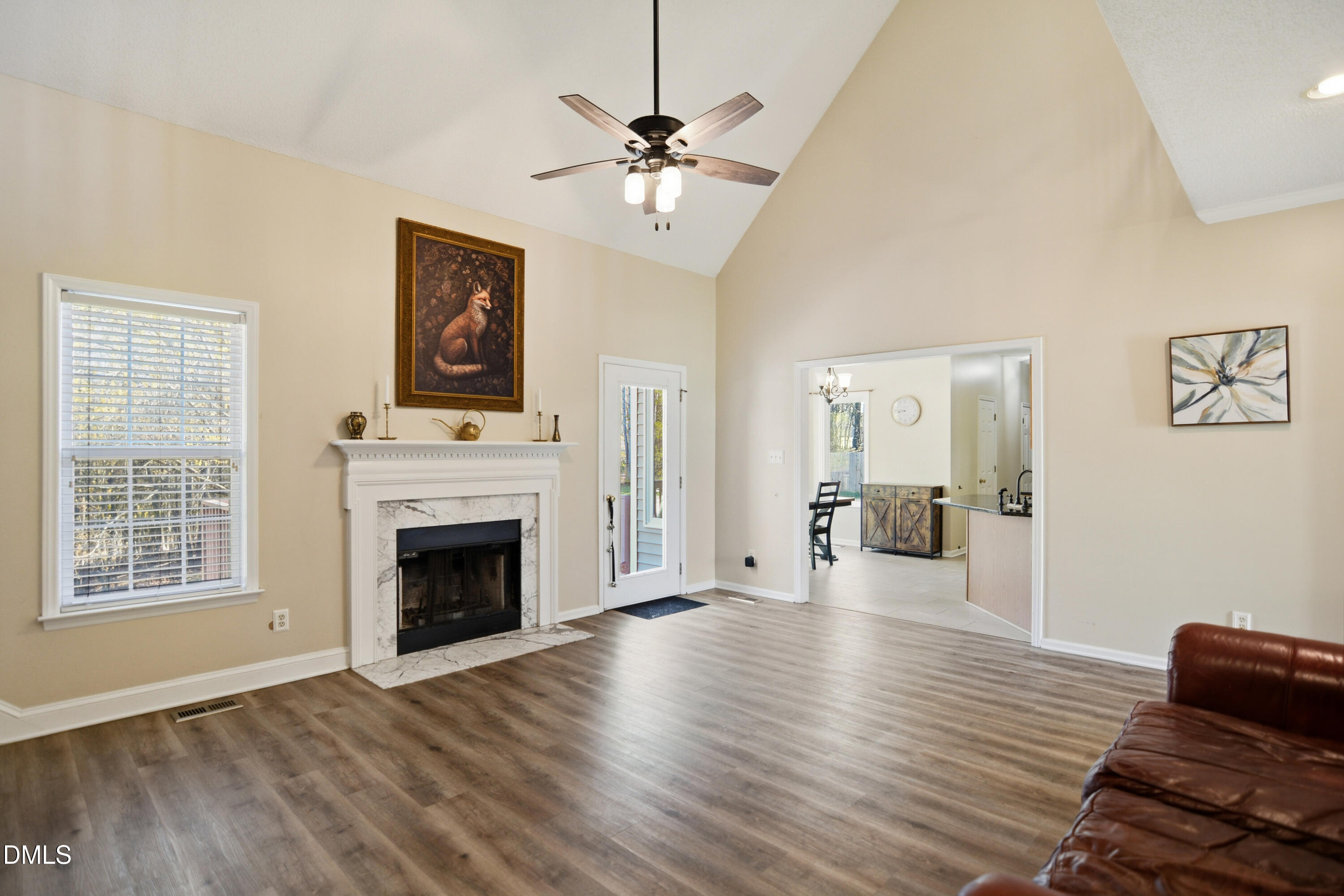 4801 Topstone Road Raleigh, NC 27603 - Photo 4 of 29 a living room with furniture and a fireplace