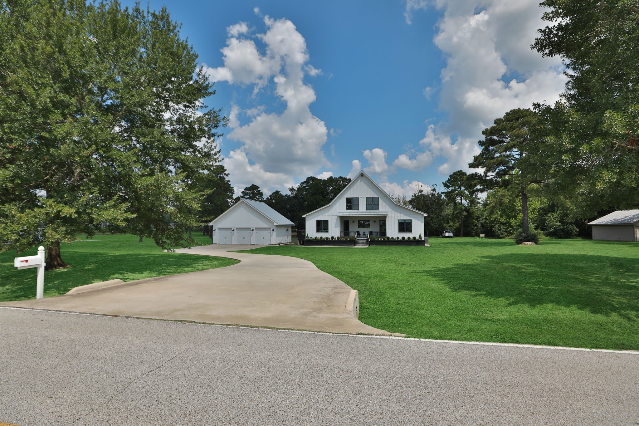1400 Hicks Street Tomball, TX 77375 - Photo 2 of 45 a front view of a house with garden