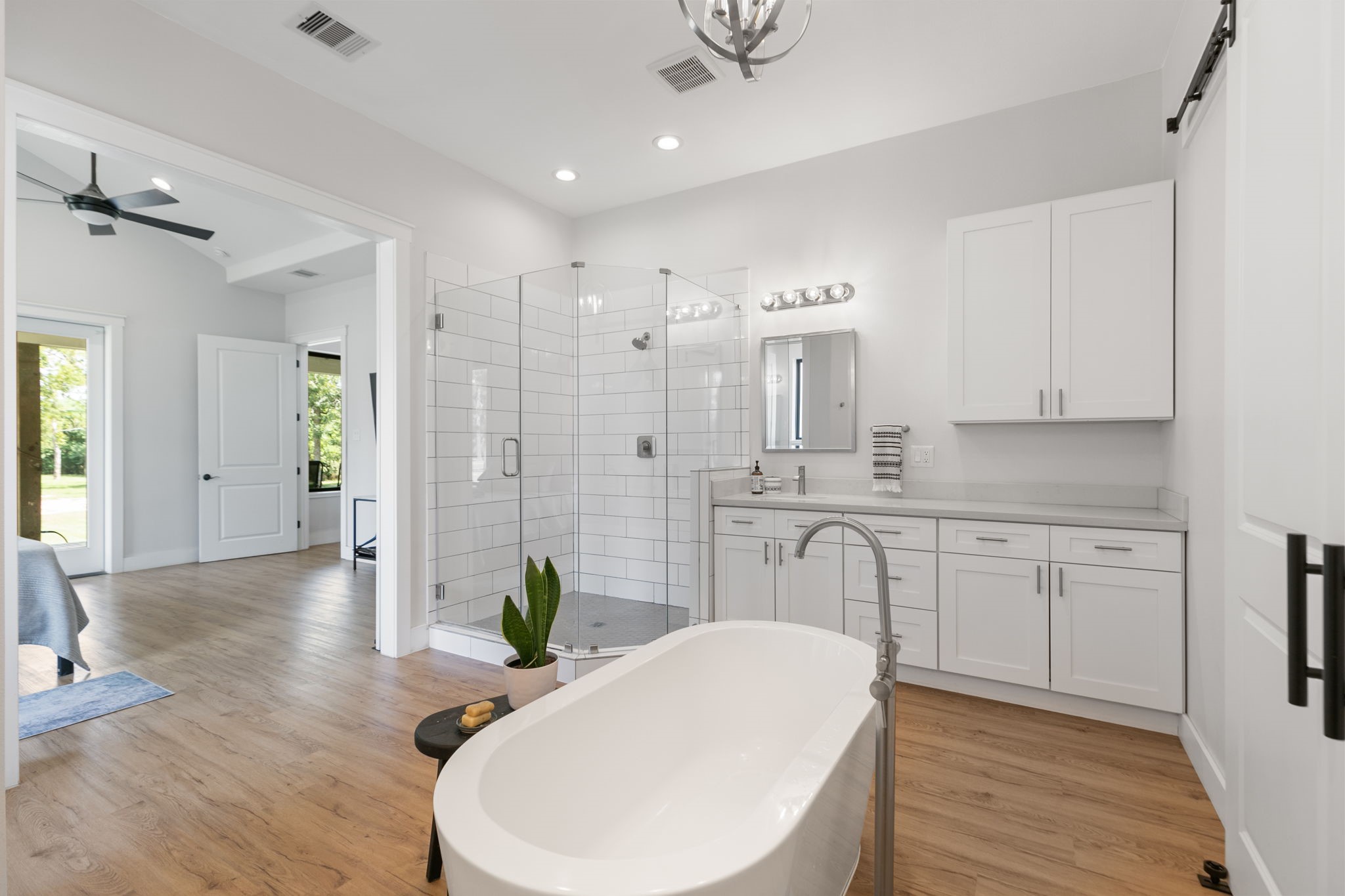1400 Hicks Street Tomball, TX 77375 - Photo 22 of 45 a spacious bathroom with a double vanity sink and a mirror