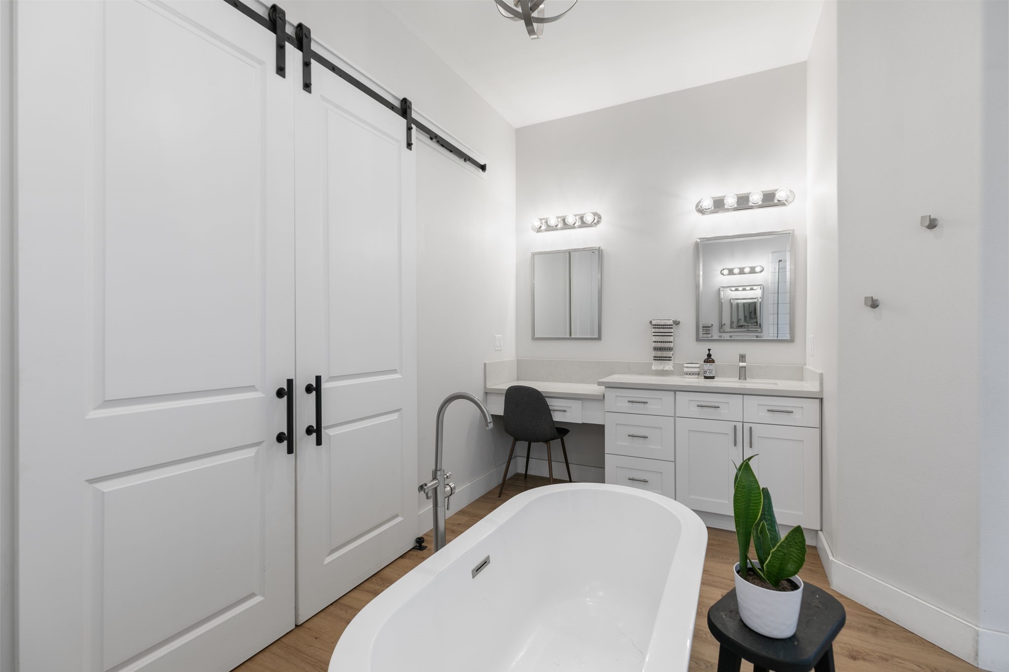 1400 Hicks Street Tomball, TX 77375 - Photo 23 of 45 a bathroom with a sink a faucet a potted plant and a bathtub