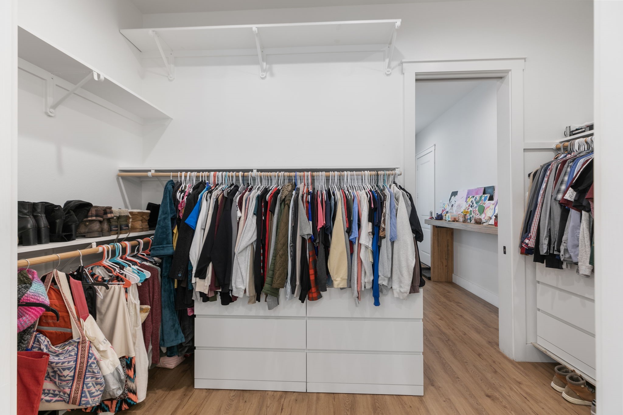 1400 Hicks Street Tomball, TX 77375 - Photo 24 of 45 a view of walk in closet with clothes and shoes