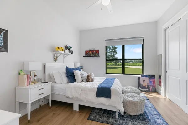 a bed room with furniture and a window