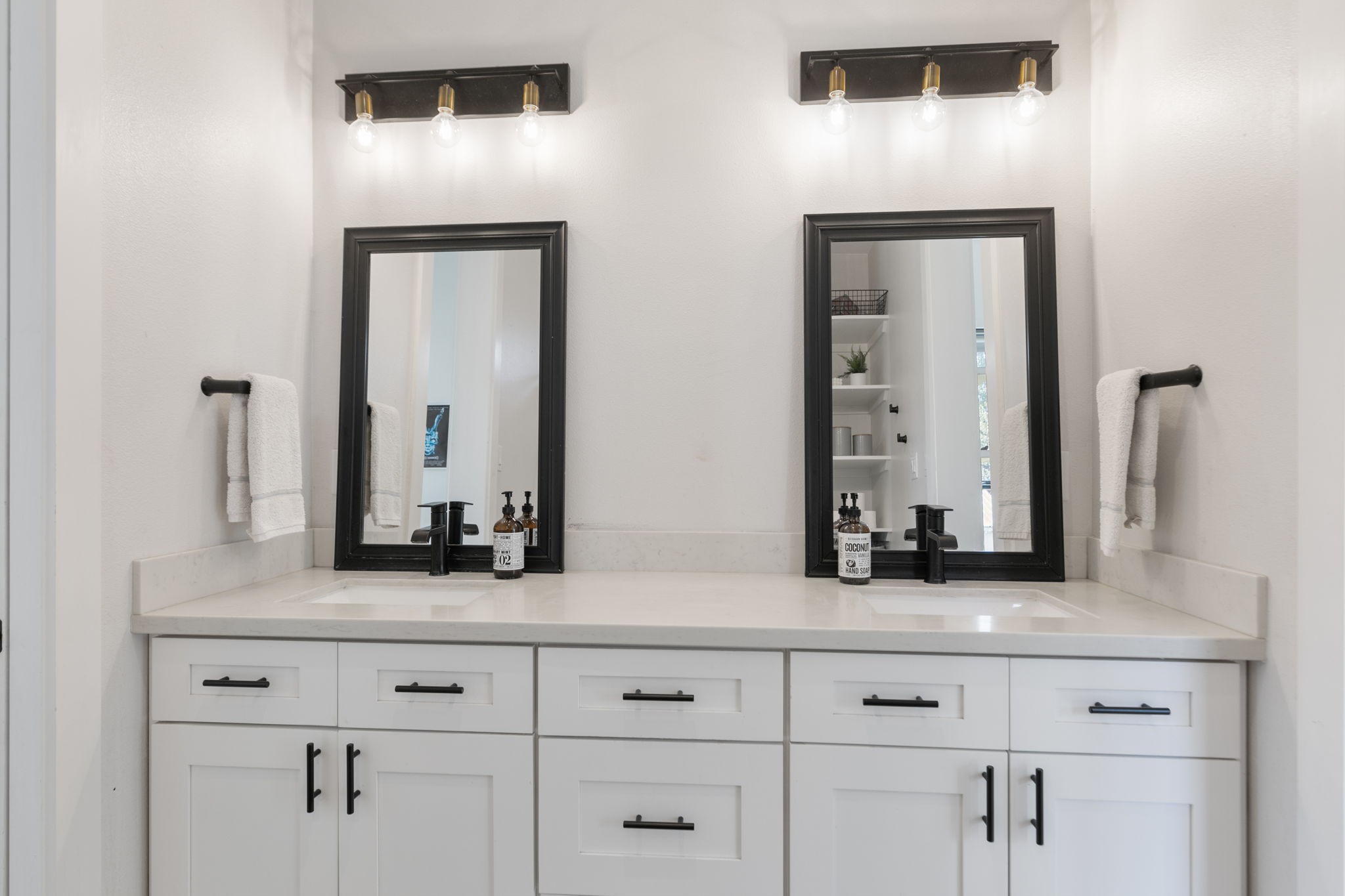 1400 Hicks Street Tomball, TX 77375 - Photo 26 of 45 a bathroom with double vanity sinks and a mirror