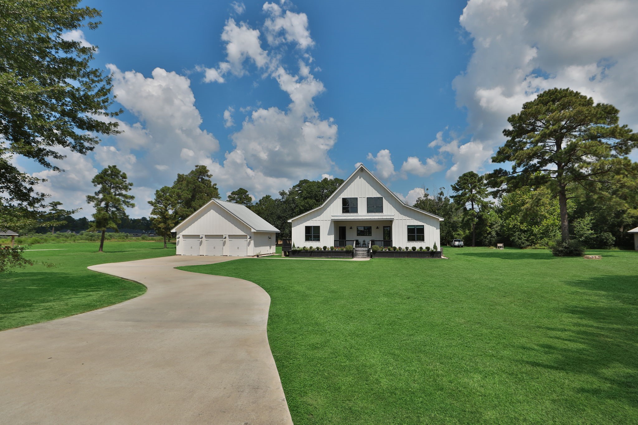 1400 Hicks Street Tomball, TX 77375 - Photo 3 of 45 a front view of a house with garden
