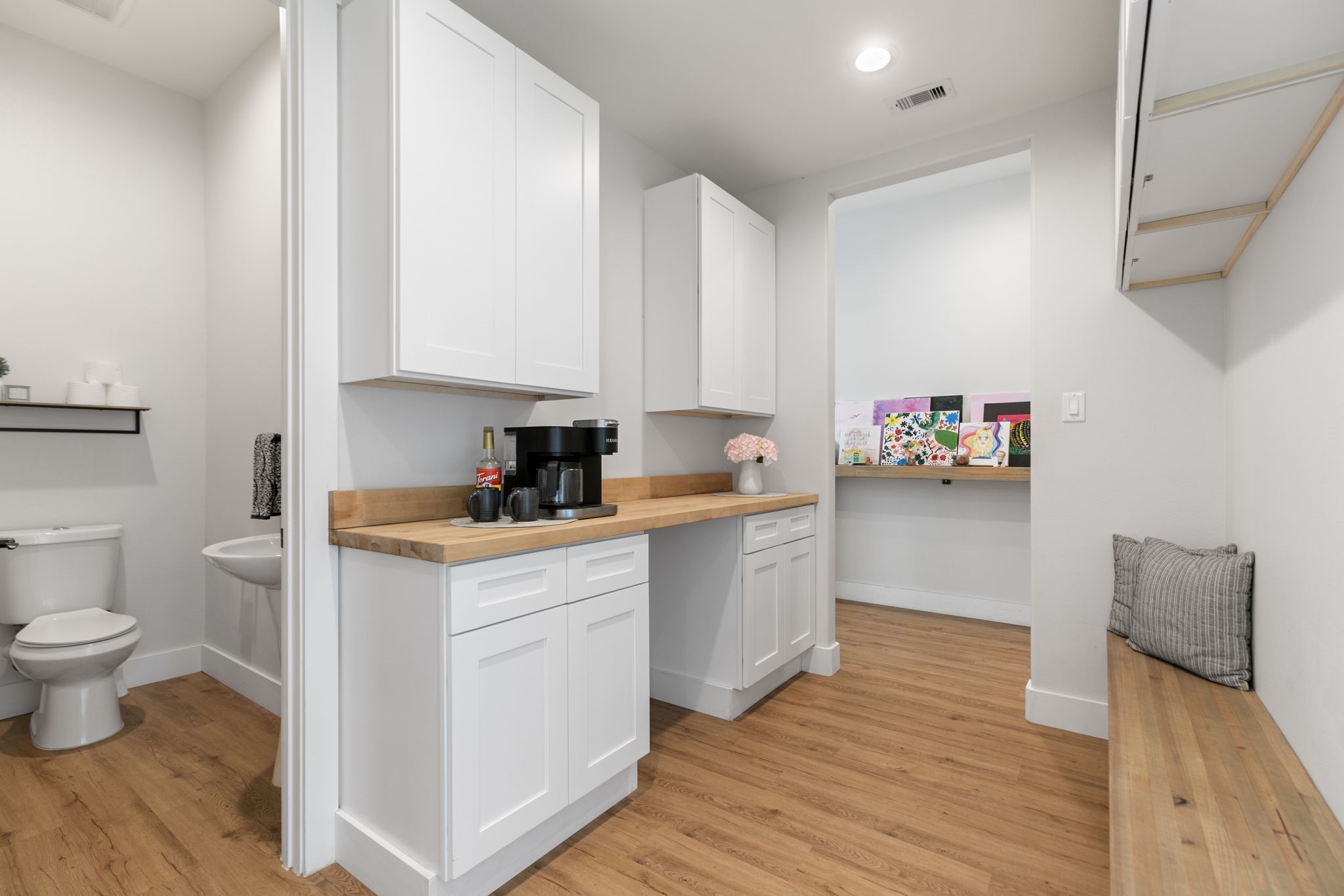 1400 Hicks Street Tomball, TX 77375 - Photo 32 of 45 a kitchen with a sink and wooden floor