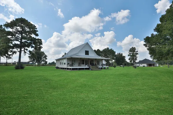 a view of a house with a big yard