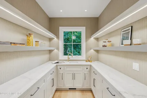 a kitchen with a sink and cabinets