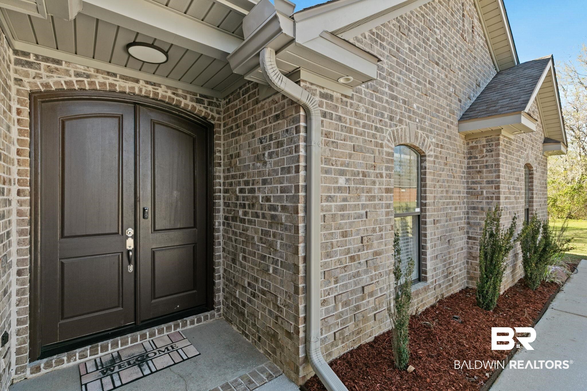 9584 Sanibel Loop Daphne, AL 36526 - Photo 7 of 48 Doorway to property featuring brick siding