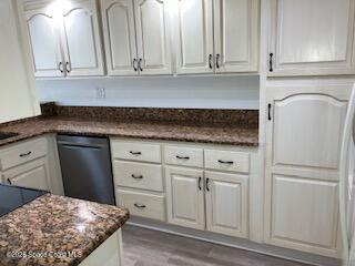 153 Augusta Way Melbourne, FL 32940 - Photo 28 of 38 a kitchen with white cabinets and sink