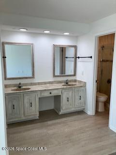 153 Augusta Way Melbourne, FL 32940 - Photo 35 of 38 a spacious bathroom with a granite countertop sink mirror and toilet