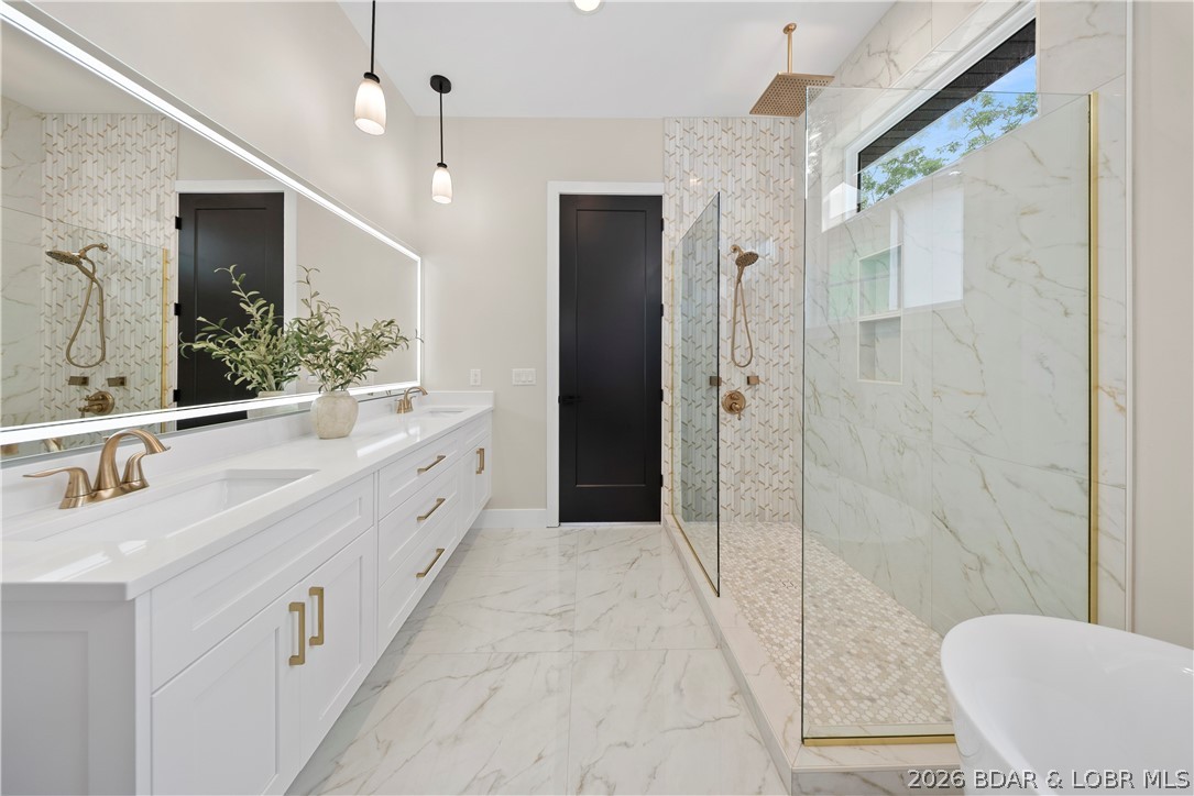 439 Red Bud Road Lake Ozark, MO 65049 - Photo 43 of 98 Elegant primary bath with oversized walk-in shower