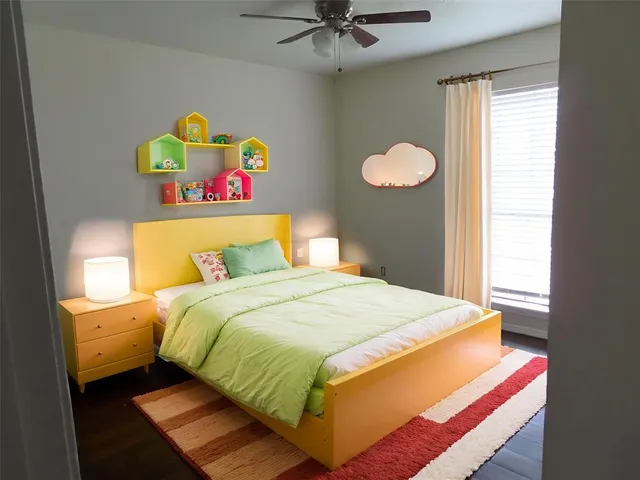 a bedroom with a bed and a window