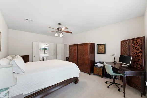 a en suite bathroom with a tub shower and window