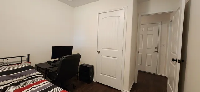 a view of workspace with wooden floor windows
