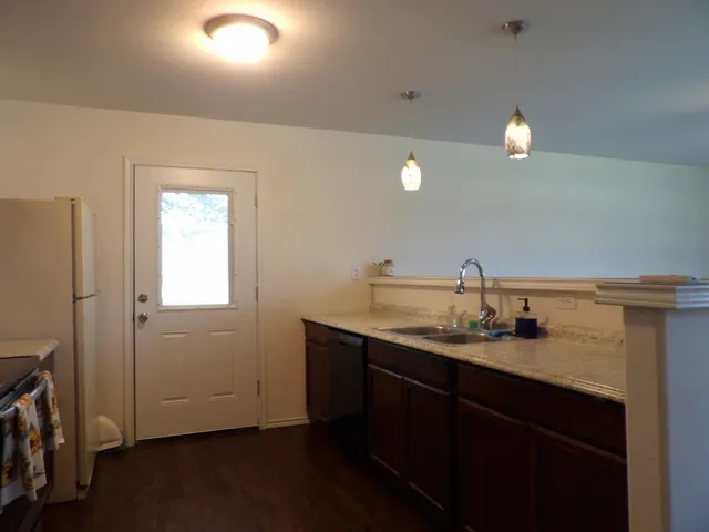 a bathroom with a sink vanity and a mirror