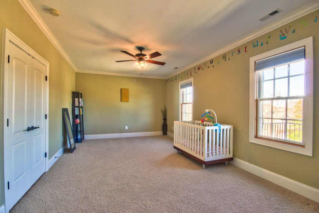 3417 Ebenezer Church Road Raleigh, NC 27612 - Photo 16 of 25 HUGE bedroom with balcony and full bath on 2nd floor. Full bath has two sinks, tiled shower. Very large walk in closet and separate water closet. Bedroom