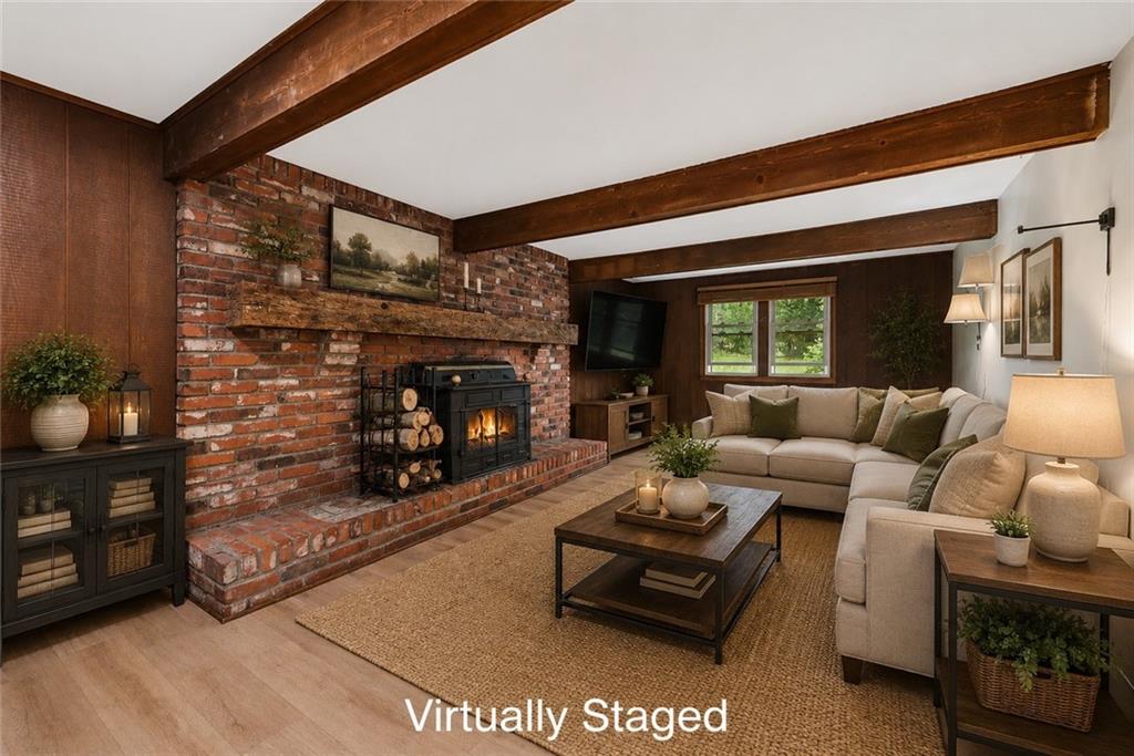22 Buzzardtown Road Irwin, PA 15642 - Photo 2 of 44 a living room with furniture and a fireplace