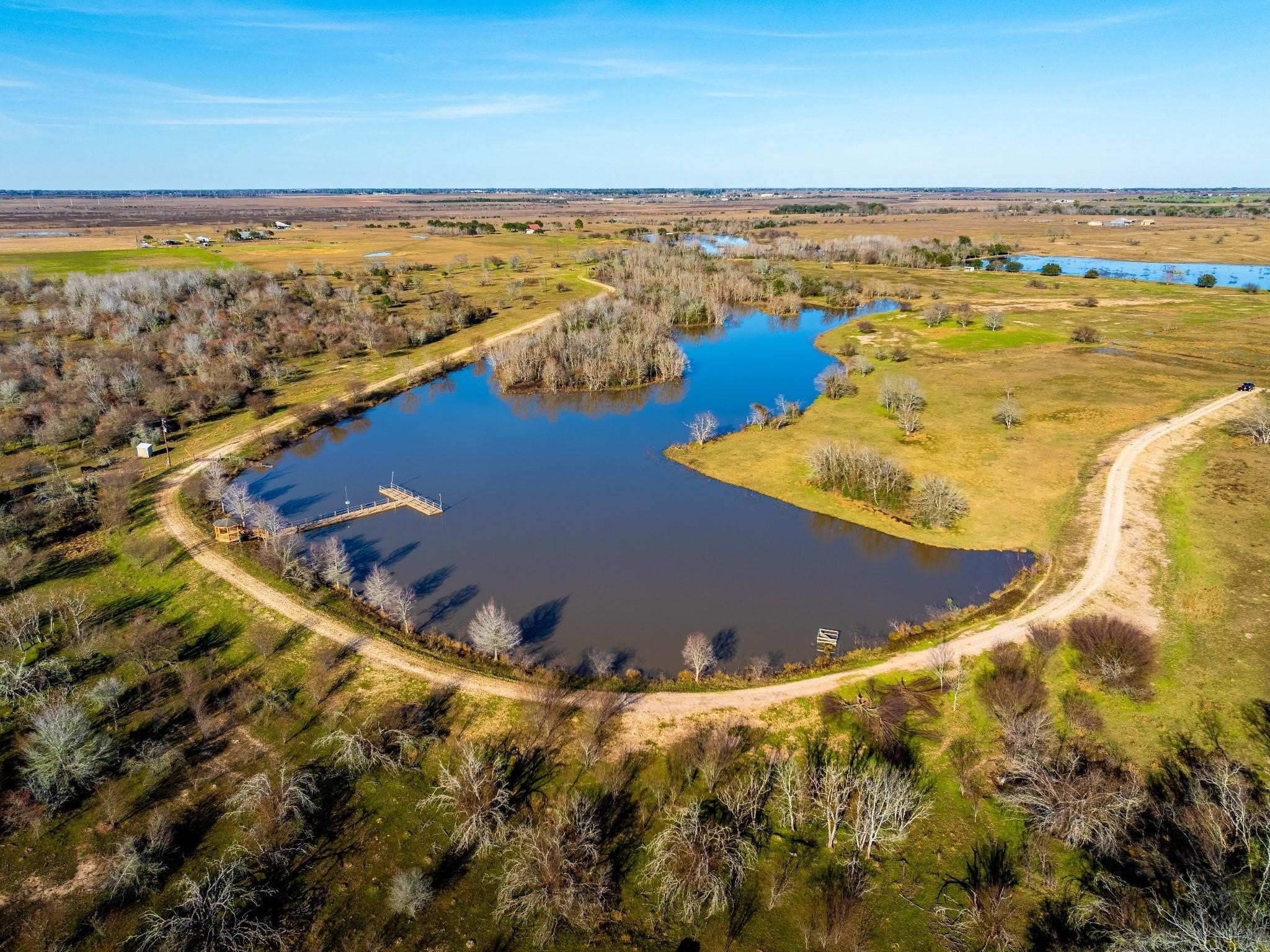 36067 Repka Road Waller, TX 77484 - Photo 7 of 14 Lake with a gazebo and boat house.