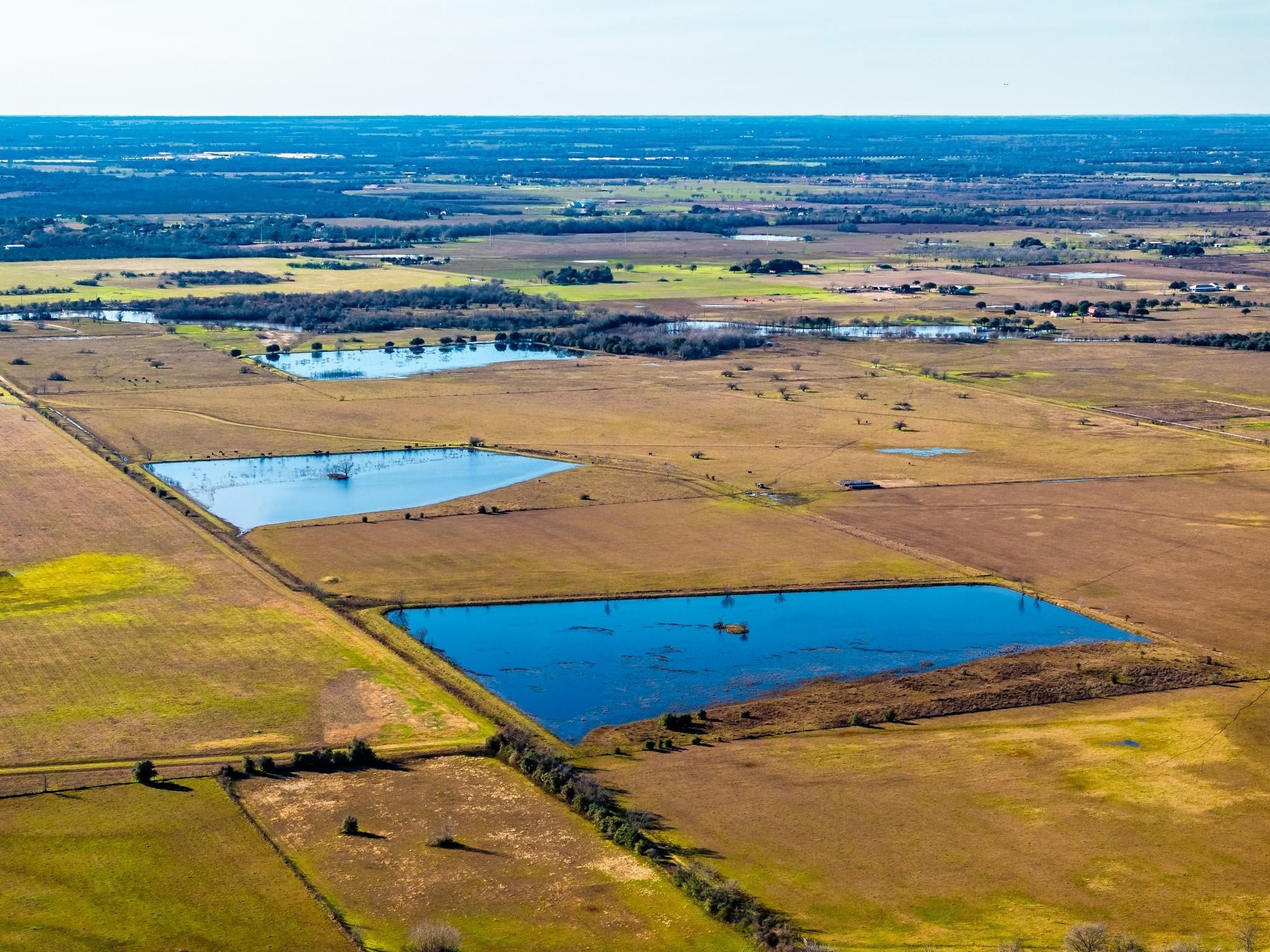36067 Repka Road Waller, TX 77484 - Photo 9 of 14 Aerial from east property line. 3 duck ponds and pasture