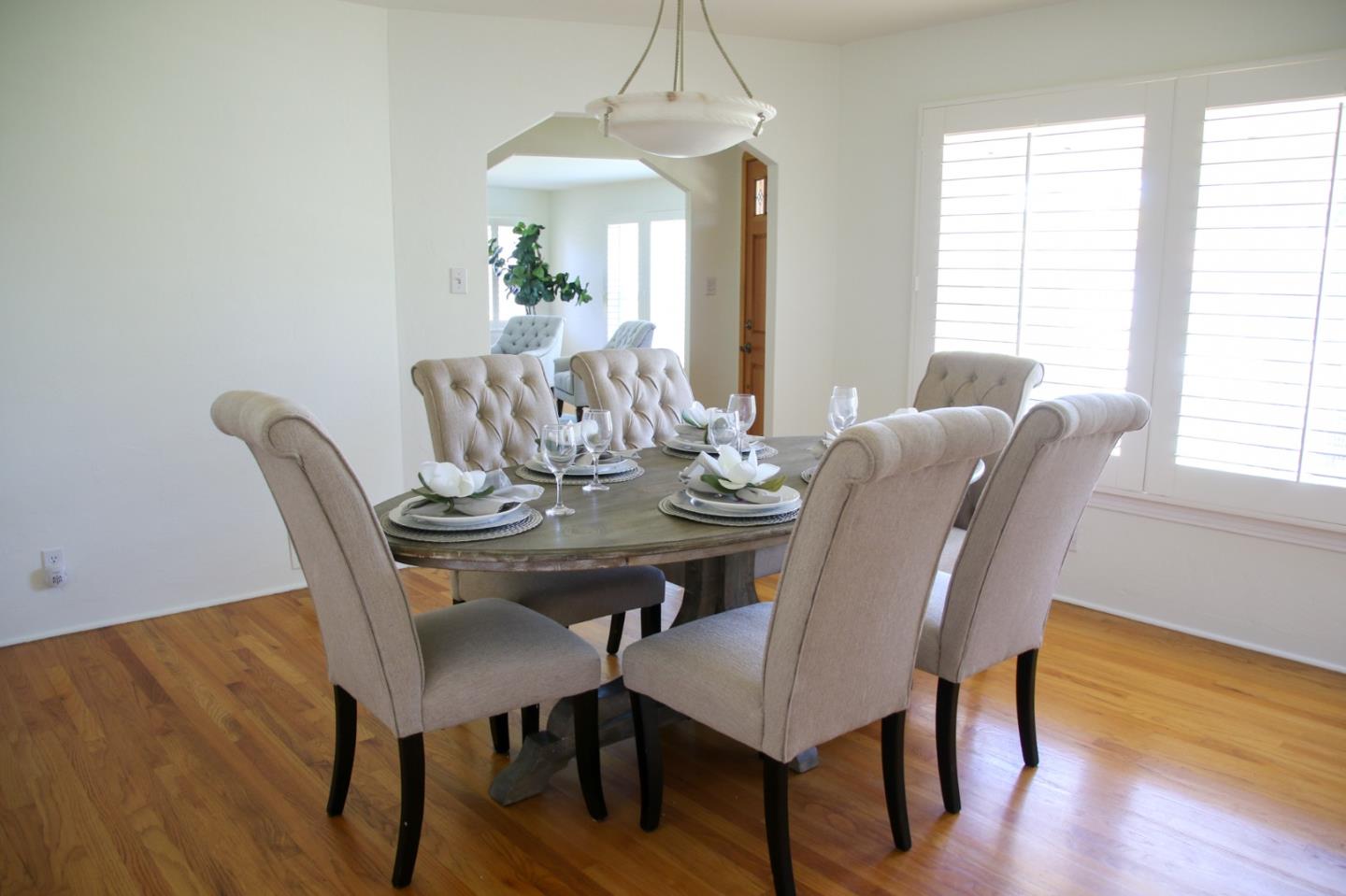 747 North 18th Street San Jose, CA 95112 - Photo 11 of 39 a view of a dining room with furniture window and wooden floor